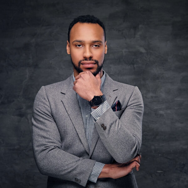 Classic studio portrait of black male dressed in a suit.